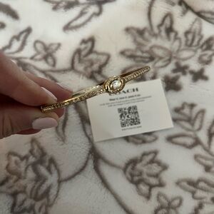 Coach Gold-Tone Bangle Bracelet with Crystal Accent